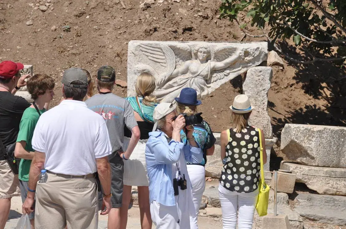 Travellers exploring Ephesus with a local guide